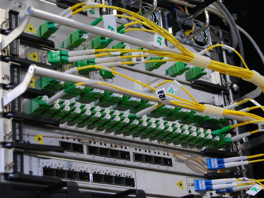 Fiber optic cables connected to network equipment in a rack